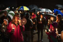 The Latest: Hundreds gather for vigil for Girl Scouts killed