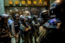 Hong Kong officers arrested for beating man in hospital