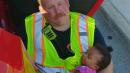 Firefighter is Hailed as a Hero For Comforting Little Girl After Car Crash