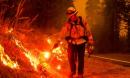 California fires burn record 2m acres as new blazes prompt rescue missions