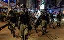 Fourteen-year-old shot in clashes between Hong Kong protesters and police in wake of face mask ban
