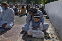 Muslims celebrate major holiday amid curfews, virus fears
