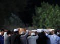 New Zealand begins funerals for mosque shooting victims, PM visits school