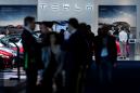 Tesla hits all-time high as firms raise price target