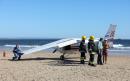 'Killer!' Angry crowd confronts pilot after girl, 8, and man are killed in crash-landing on Portuguese beach
