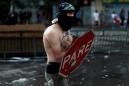 Looking for a hero: shirtless Chilean protester, police-hating dog rise to fame