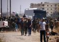 Syria rebels evacuate 'cradle' of uprising as Israel strikes north