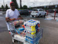 The Latest: Shoppers fill carts with supplies ahead of Barry