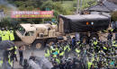 US adds launchers to THAAD as dozens hurt in SKorea protests