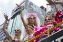 Tens of thousands join gay pride parades around the world