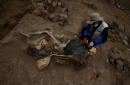 At ancient pyramid in Peru, remains of 20th century Chinese laborers found