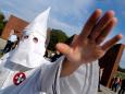 Colorado police are looking for a man seen at a grocery story wearing a KKK hood with a swastika