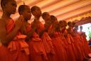 Thai cave boys leave Buddhist monastery after honouring dead rescuer