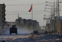 The Latest: Turkey says troops captured Syrian border town